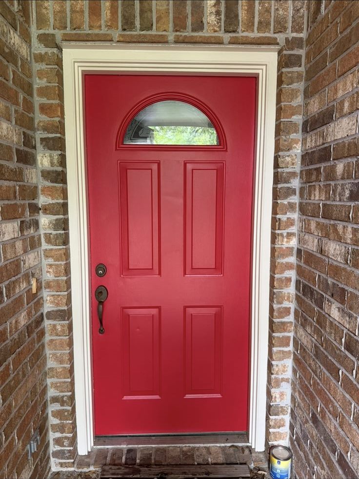 Front door after repainting, bold clean red, exterior house painting in Brazos Valley, TX