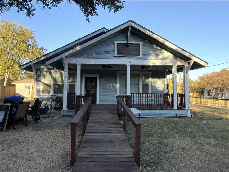 Exterior house painting before, faded siding and weathered wood ramp on a home in the Brazos Valley, TX (College Station and Bryan)