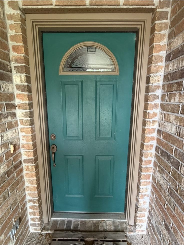 Front door before repainting, faded teal, exterior painting project in the Brazos Valley, TX (College Station and Bryan)